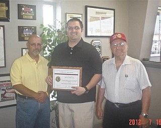 The Canfield Lions Club recently presented Haus Motors with a plaque to thank them for their many years of dedication to the club. Haus Motors has partnered with the Lions in many projects. Pictured are King Lion Dan Grossman, left; Lion Chris Haus, center, receiving the award; and Immediate Past King Lion Harry Pancher, right. The Canfield Lions Club was chartered in 1978, is in its 34th year and has 50 members. The club is currently recruiting. Members meet at A La Cart Catering the first and third Thursdays of each month. For information call Pancher at 330-533-3669.