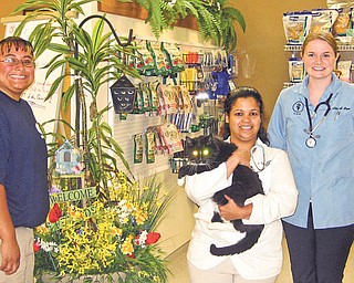 The Humane Society of Columbiana County will host a Chips and Dips (microchips and dog-bathing dips) event from 11:30 a.m. to 1:30 p.m. Saturday at their ROCC and Rescue Center, 1825 S. Lincoln Ave., Salem. Pictured from left to right are Stephanie Peterson of the society, Dr. Sarah Hopkins, holding Felix, and Dr. Alicia Boyce. Microchips will cost $20, which will include registration, or $23 for the mini chip, which is perfect for cats and small dogs. Dog grooming, which includes a nail trim, ear cleaning, perfume and bandana, will cost $10 for small dogs, $15 for medium dogs and $20 for large dogs. Veterinarians and groomers have donated their time, so all proceeds can go toward medical costs to animals in the society’s care. From 11 a.m. to 3 p.m. there also will be a ROCC and Reunion Day. Attendees are welcome to take their pets for contests and giveaways. Those who donate shelter supplies such as kitty litter, laundry detergent, latex gloves and gift cards will receive event T-shirts. Gina McQuillian of State Farm Insurance, adjacent to HSCC, will host a rummage sale from 9 a.m. to 3 p.m. and Dairy Queen, also adjacent to the center, will have hot dog and cool treat deals to benefit HSCC.