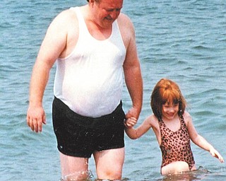 Sue Devon took this photo of her husband, Bill, and daughter Emily at a Lake Erie beach when Emily was 3 years old.