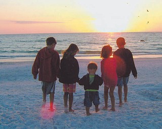 Evan and Madison Macko and Paulie, Anna and William Laczo, all grandchildren of Paul and Vicki Laczo of Poland, enjoy some time together at Siesta Keys, Fla., in 2010. Photo sent in by Vicki Laczo.