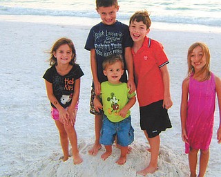 Evan and Madison Macko and Paulie, Anna and William Laczo, all grandchildren of Paul and Vicki Laczo of Poland, enjoy some time together at Siesta Keys, Fla., in 2010. Photo sent in by Vicki Laczo.