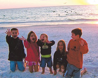Evan and Madison Macko and Paulie, Anna and William Laczo, all grandchildren of Paul and Vicki Laczo of Poland, enjoy some time together at Siesta Keys, Fla., in 2010. Photo sent in by Vicki Laczo.