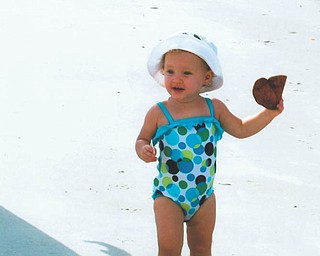 Mena Monroe, 22 months, delights in having fun at St. Pete Beach in Florida. She's the granddaughter of Russell and Ellen Monroe of Austintown.