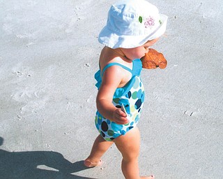 Mena Monroe, 22 months, delights in having fun at St. Pete Beach in Florida. She's the granddaughter of Russell and Ellen Monroe of Austintown.