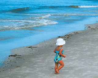 Mena Monroe, 22 months, takes a stroll on St. Pete Beach in Florida. She's the granddaughter of Russell and Ellen Monroe of Austintown