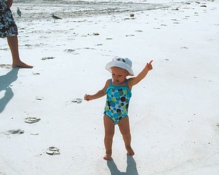 Is that a disco move? Mena Monroe, 22 months, delights in having fun at St. Pete Beach in Florida. She's the granddaughter of Russell and Ellen Monroe of Austintown.