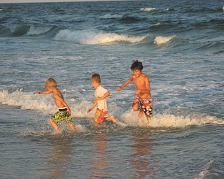 Jennifer Walker sent in this photo of her sons, Benjamin, Owen and Zachary Walker, fighting the waves at Myrtle Beach in 2010.