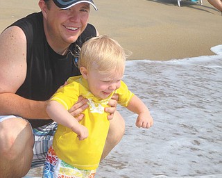 Zachary Reel, 15 months, gets his feet wet during his first time in the ocean with his dad, David Reel. Photo sent in by Elizabeth Reel of Hubbard.