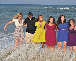 The “Kuhns Cousins” were posing for this photo at the Outer Banks, N.C., when they were surprised by a pretty large wave. From left are Allison Dickey, Ethan Parks, Devon Parks, Lauren Parks, Jenny Fisher and Katie Lane. Photo submitted by Dawn Dickey.