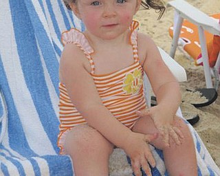 Naomi Lane, granddaughter of Dave and Dawn Dickey of North Lima, experiences the beach for the very first time this year.