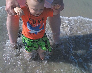 Logan Nicholas, 18 months, gets a taste of his first time in the ocean in Holden Beach, N.C. Photo sent by Rita Nicholas.