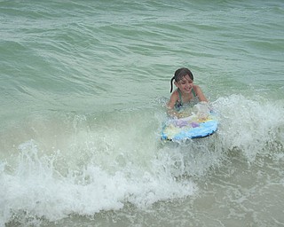 Kelly Alexander sent in this photo of her daughter Marissa riding the waves at Fort Myers Beach in Florida. "I love the pure happiness on her face!" Kelly writes.