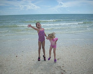 Sisters Marissa and Camryn jump for joy on the beach in Florida. Photo sent in by Kelly Alexander.