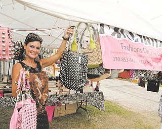Different Fair as Kerry Florie of Boardman - shows off her bling purses at the fair - "Fashions on the go"
Columbiana Fair est 1845 The Columbiana Fair is again on till Aug 5.