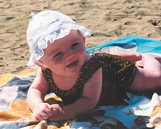 Kacey Whistler was 4 months old in this 2002 picture, as she smiles at her Uncle Don while relaxing at Lake Erie.
