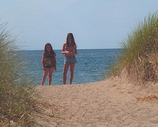 Sisters Kacey, 10, and Kay Lee, 14, Whistler enjoy a day in the sun at Lake Erie.