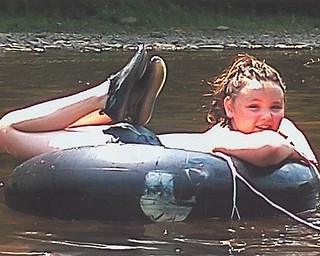 Kacey Whistler, 10, goes tubing on the Clarion River in Pennsylvania.