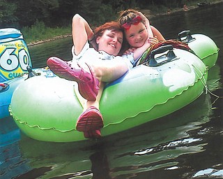 Katrina Wolfe and daughter Kacey Whistler, 10, are tubing on the Clarion River in Pennsylvania.