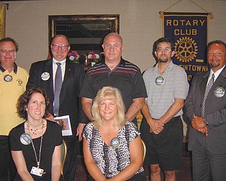 Leaders of Austintown Rotary Club for the 2012-13 term who were sworn in at the July 16
meeting are, seated, Jennifer Connolly, left, secretary, and Tracy Kaglic, community
service; and standing from left, Ron Carroll, president; Chuck Baker, who conducted the
installation; Mal Culp, treasurer; Kristopher Sperry, international service chairman; and
Mark Cole, vice president. They are among more than 1.2 million Rotarians in
33,790 clubs worldwide.