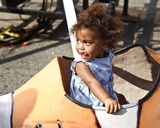 Payton Hrosar, 2, rides a fish ride at the Greater Youngstown Italian Festival on August 4, 2012.
