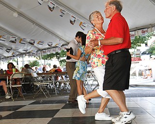 Ginny Fawcett and George Fawcett share a dance during a performance by the Jim Frank Combo at the Greater Youngstown Italian Festival on August 4, 2012.