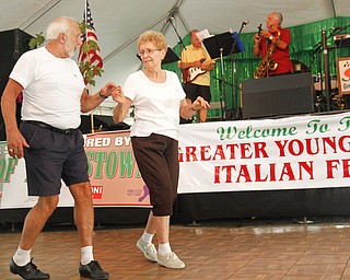 Paul Karabian and Helen Mayorgan start to dance during a song performed by Jack Vasko and Company at the Greater Youngstown Italian Festival on August 4, 2012.