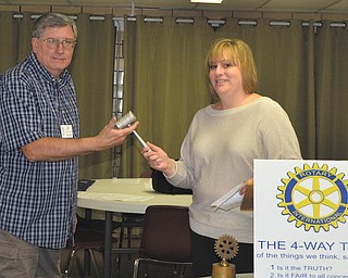 Traci Thompson, outgoing president of East Palestine Rotary Club, passes the gavel to John Davis, incoming president for 2012-13. Serving with Davis are Mary Ann Steiner, vice president; Roger Linsley, treasurer; and Bonnie Davis, secretary.