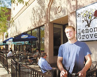 Jacob Harver, the owner of The Lemon Grove, stands in front of the restaurant’s new location at 110 W. Federal St., where a grand-opening event will be Thursday starting at 7 p.m., featuring local music and food.