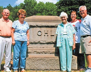 Standing at the tombstone of Michael Ohl, founder of Ohltown, are descendants, from left, Lester Handwork, Mary Liming, Margaret Grace and Cheryl and Lloyd Zimmet. The 135th Ohl family reunion will take place Aug. 19 at Ohltown United Methodist Church, Mineral Ridge.