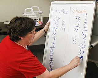 Karen Saunders of Boardman, Ohio tallies the points between the Pacman group and the Ghost group during the 'Live Pacman' game hosted by the Boardman Library on August 9, 2012.