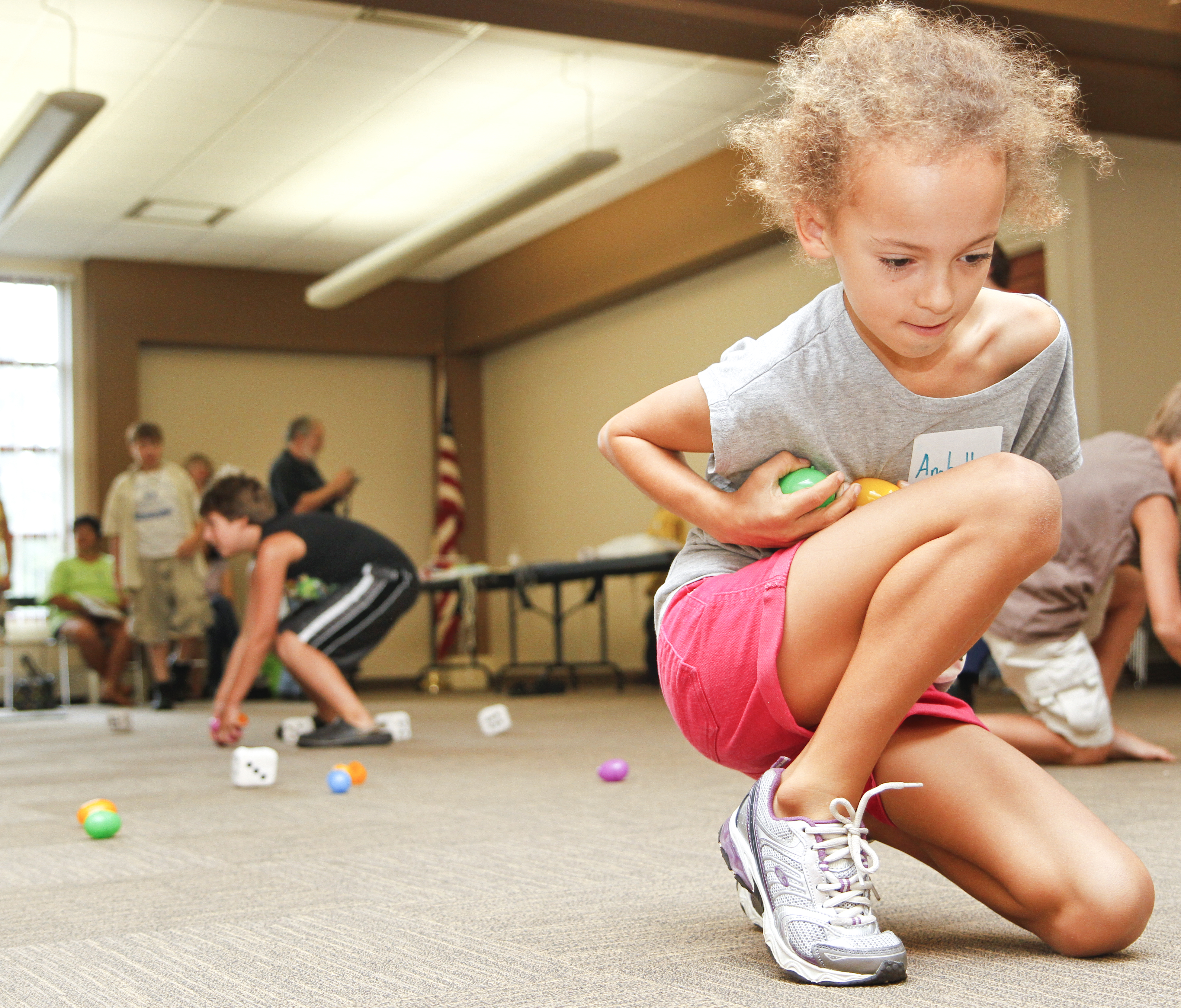 Anabella Soanes-Carter, 9, of Boardman, Ohio collects eggs during the 'Live Pacman' game at the Boardman Library on August 9, 2012. 