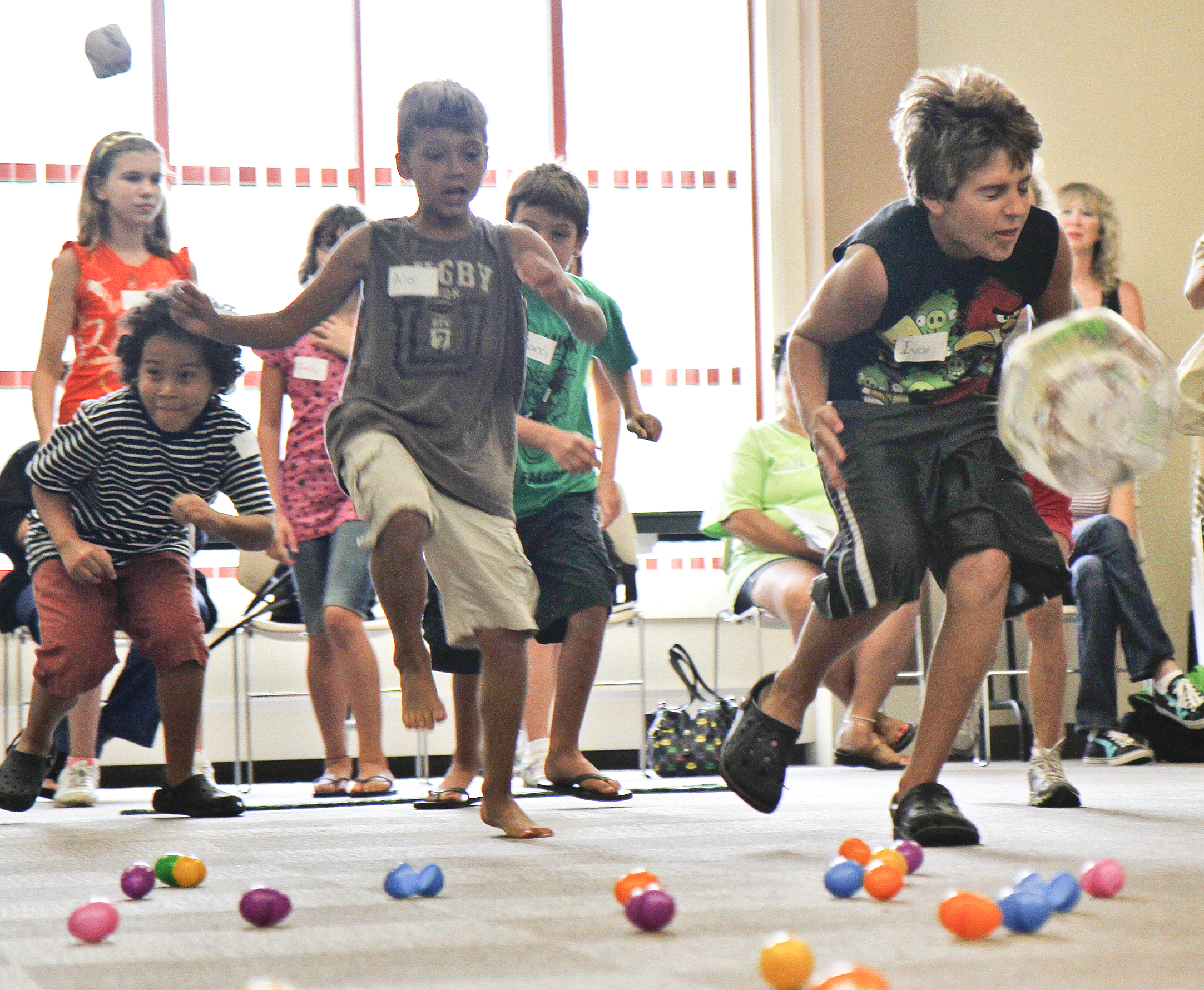 (L-R) Sean Lee, 9, of Boardman, Alec Bosnjak, 9, of Poland, and Ivan Bosnjak, 11, of Poland run to the finish line while trying not to get hit by a ball thrown by the other team.
