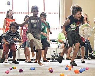 (L-R) Sean Lee, 9, of Boardman, Alec Bosnjak, 9, of Poland, and Ivan Bosnjak, 11, of Poland run to the finish line while trying not to get hit by a ball thrown by the other team.