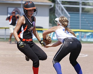 Ally Deemer tags an Escanaba All Star out on first base.