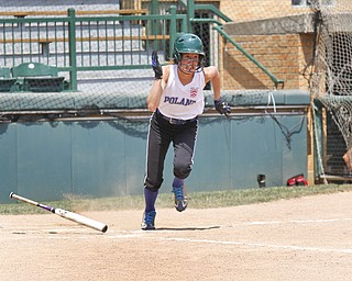 Kat Wilson drops her bat and runs for first after hitting.
