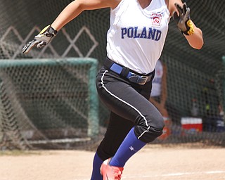 Claire Testa runs for first after making a hit.