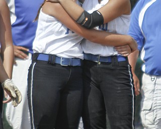 Cara Kalouris and Jenna Schettler hug after the loss of the game.