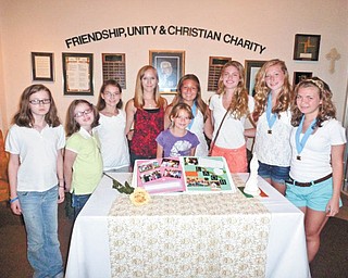 The Junior LAOH Golden Rose Division took the top award in a national scrapbook competition recently. From left to right are Morgan and Brighid Donnelly, juniors; Audra Pesko, scrapbook committee; Heather Foust and Megan Wilson, juniors; and Alexis Jacobs, Christine Kerrigan, Isabel Stoeber and Rachel Kepley (president), scrapbook committee. Not pictured are Brianna and Ashley Thompson, Mary Kate Kelty, Erin Loomis and Kristen Eckman, all on the scrapbook committee. Also not pictured are juniors D’Ella and Millie Heschmeyer, and Cynthia and Victoria Romeo.