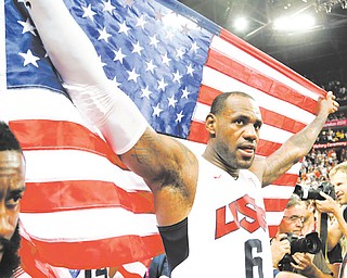 The United States’ LeBron James celebrates after the men’s gold-medal basketball game Sunday at the 2012 Summer Olympics in London. The U.S. won 107-100.