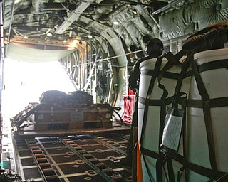 ROBERT K. YOSAY | THE VINDICATOR..payloadexits the back of the C130 H to a location in the Ravenna Arsenal - .-30-