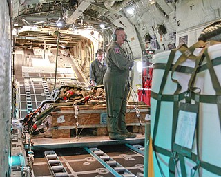 ROBERT K. YOSAY | THE VINDICATOR..Doing a last minute check on the payload that will be dropped on the Ravenna arsenal is Sgt James Hudson .. farthest from camera and MSgt Bob Zanni ..-30-