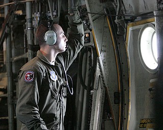 ROBERT K. YOSAY | THE VINDICATOR..Sgt James Hudson.. takes a moment to check out the drop zone - at the Ravenna Arsenal - ...-30-