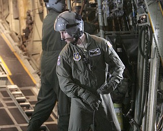 ROBERT K. YOSAY | THE VINDICATOR.. cleaning up straps in the back of the C-130 after it dropped a 3000 lb payload is SraMarcus Watson and Sgt James Hudson -30-