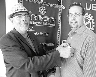 Ronald Faniro, left, president of Rotary Club of Youngstown, welcomes new member Jerry Savo. Savo has been chief financial officer of Easter Seals of Mahoning, Trumbull and Columbiana counties since 2009. He serves on the advisory board of ITT Technical Institute in Youngstown and volunteers at Northeast Ohio Adoption Agency. He also is a member of Youngstown-Warren Regional Chamber.