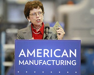 ROBERT K. YOSAY | THE VINDICATOR..Rebecca Blank holds up a piece of metal used to check pressure in an apparatus - a 30 Million dollar grant for a manufacturing hub was announced today at M7 Technologies - .Obama officials, including White House National Economic Council Director Gene Sperling, Acting U.S. Commerce Secretary Rebecca Blank, Under Secretary of Defense Frank Kendall and a host of other manufacturing officials will be at M-7 Technologies.. - -30-..