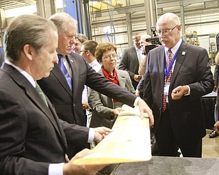 ROBERT K. YOSAY | THE VINDICATOR..White House National Economic Council Director Gene Sperling, Acting U.S. Commerce Secretary Rebecca Blank, Under Secretary of Defense Frank Kendall listens to Ralph Resnick as he explains a drones wing span made by STRATASYS of St Peters Mo. - ..a 30 Million dollar grant for a manufacturing hub was announced today at M7 Technologies - .Obama officials, including White House National Economic Council Director Gene Sperling, Acting U.S. Commerce Secretary Rebecca Blank, Under Secretary of Defense Frank Kendall and a host of other manufacturing officials will be at M-7 Technologies.. - -30-..