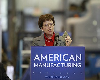 ROBERT K. YOSAY | THE VINDICATOR..Rebecca Blank holds up a piece of metal used to check pressure in an apparatus - a 30 Million dollar grant for a manufacturing hub was announced today at M7 Technologies - .Obama officials, including White House National Economic Council Director Gene Sperling, Acting U.S. Commerce Secretary Rebecca Blank, Under Secretary of Defense Frank Kendall and a host of other manufacturing officials will be at M-7 Technologies.. - -30-..