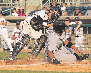Scrappers catcher Jeremy Lucas tags out Jamestown’s Jesus Solorzano on a throw from third baseman Erik Gonzalez during the seventh inning.