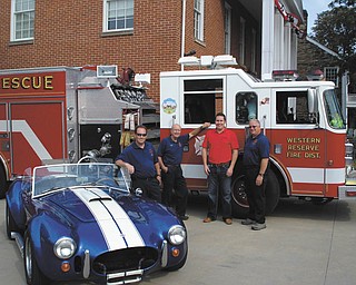 From left are Poland firefighters Tim Clavin and Sonny Chinowth, Poland Rotarian Matt Bodine and firefighter Dave Chapman with one of the cars that will be featured at the third annual Poland Rotary Car and Bike Show. The 2012 edition of the show will take place from 6 to 9 p.m. Wednesday at Poland United Methodist Church, 1940 Boardman-Poland Road. Antique and muscle cars as well as custom motorcycles will be part of the show. A basket raffle, 50-50 raffle, music and food will round out the activities. Proceeds will help Poland Firemen’s Association purchase additional emergency equipment for pediatric patients needed because of the specialized nature of dealing with infants and small children. A grant from Rotary International Foundation also will be used for this project. For information call Matt Bodine at 330-702-8100 or email matt@bodineperry.com.