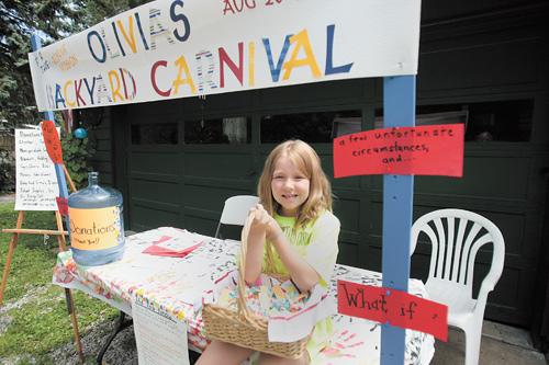 Olivia Helmick’s smile, as she sits at the booth announcing Olivia’s Backyard Carnival, seems to say “come on over” Sunday to her house at 8793 Woodland Road, just off Arrel Road and state Route 170 in Poland Township, and enjoy the fun and help homeless people at the same time.